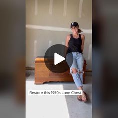 a woman sitting on top of a wooden dresser next to a wall with the caption restore this 1950's lone chest