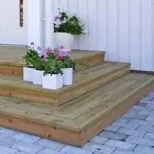 two planters are sitting on the steps outside