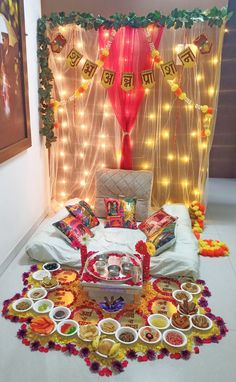 a decorated room with food and decorations on the floor