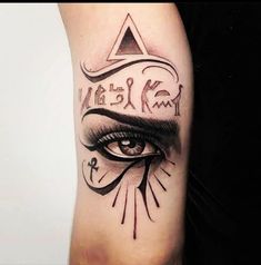 a woman's arm with an all seeing eye tattoo on it