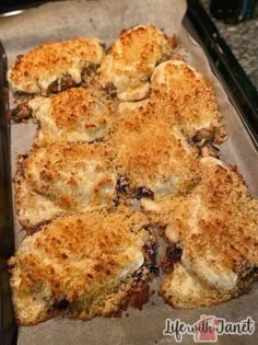 some food is laying out on a baking sheet and ready to be cooked in the oven