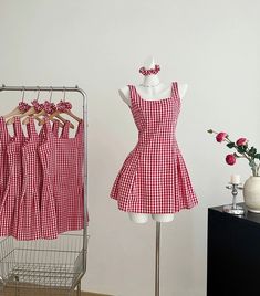 Square neck cami dress with a flared waist and classic gingham print. Concealed side zipper. Cute on its own or layered with a short sleeve blouse. Comes with a matching hair scrunchie. S: 36" chest, 30" waist, 30.5” lengthM: 37.5" chest, 31.5" waist, 30.5” lengthL: 39" chest, 33" waist, 30.5" length Gingham Mini Dress, Mini Dress Red, Photoshoot Concept, Candy Shop, Gingham Print, Red Mini Dress, Overall Dress, Sweater Blouse, Cami Dress