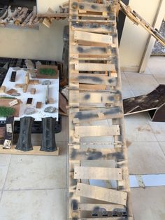 an old wooden ladder sitting on top of a tiled floor