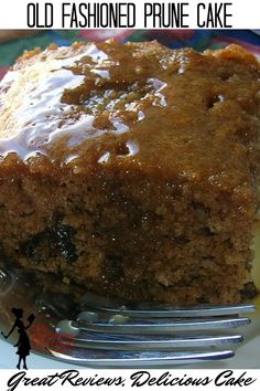 a close up of a piece of cake on a plate with a fork in it