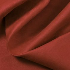 the fabric is very soft and shiny in color red, it looks like an elegant piece of cloth