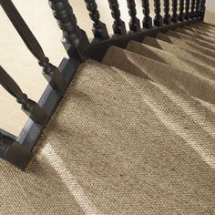 an image of a stair case with carpet on it