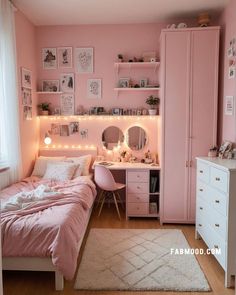 a bedroom with pink walls and white furniture