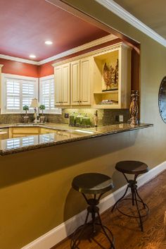 the kitchen is clean and ready to be used as a living room or dining area