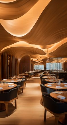 the interior of a restaurant with wooden tables and chairs