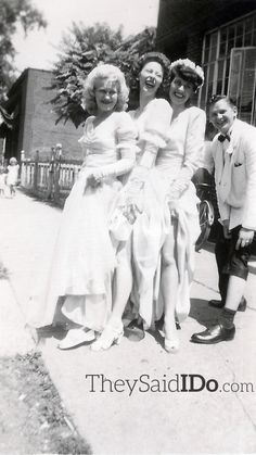 an old black and white photo of three women in dresses