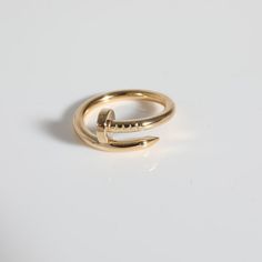 Cartier Juste Un Clou Ring (Yellow Gold)  PRIMARY DETAILS  SKU: 141331  Listing Title: Cartier Juste Un Clou Ring (Yellow Gold)  Condition Description: Translating to 'just a nail', the Juste Un Clou collection from Cartier is one of the Maison's most celebrated styles. The collection was born in the '70s and represented the brand's edgier side and flair for unique design.     Retails for 2660 USD. In excellent condition and recently polished. Ring size is 8. Comes with Box;Certificate of Authenticity;  Brand: Cartier  Collection/Series: Juste Un Clou  Metal Type: Yellow Gold  Metal Purity: 18k  Ring Size: 8  Pre-Owned Jewelry Condition: Excellent  SIDE STONE INFORMATION  Original Box?: Yes  Original Papers?: Yes  This item has been used and may have some minor flaws. Before purchasing, pl Cartier Nail Ring, Cartier Gold Ring, Cartier Juste Un Clou Ring, Juste Un Clou Ring, Cartier Juste Un Clou, Cartier Gold, Nail Ring, Contemporary Ring, Cartier Jewelry