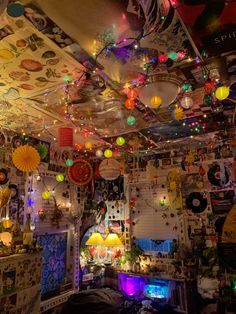 a room filled with lots of decorations and lights hanging from the ceiling over it's windows