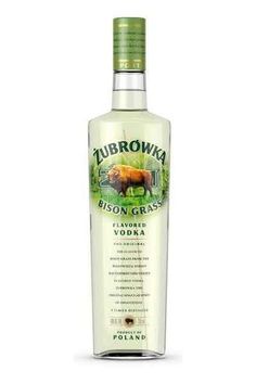 a bottle of zubrowka vodka with an image of a cow on it