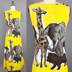 "Showstopping 1960s maxi dress by designer Dorothy McNab, featuring a knock-out print of African animals - giraffes, elephants, lions, camels and monkeys - on a vibrant yellow background. Dorothy McNab was an Australian-born designer based in Montego Bay, Jamaica, specialising in hand-blocked prints and hand-embroidered fabrics, whose customers included Princess Margaret of England. McNab designed from the mid 1950s to the late 1960s, and some of the clothing she designed is now part of the collection held by the Metropolitan Museum of Art.  * Flattering boat neckline * Darts at the bust * Fitted waistline flows into an A-line shape towards the hem with no horizontal waist seam, just shaped side seams * Front and back are each made of a single piece of printed fabric, with the motif repeat 60s Maxi Dress, Vintage Dresses 1960s, 1960s Dress, Safari Print, Late 1960s, 1960's Dress, Princess Margaret, Hip Ups, Montego Bay