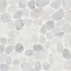 a white and gray stone floor with small rocks