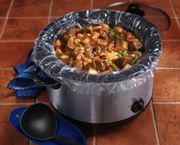 a pot filled with food sitting on top of a tiled floor