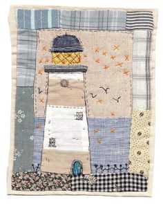 a patchwork quilt with a lighthouse on it