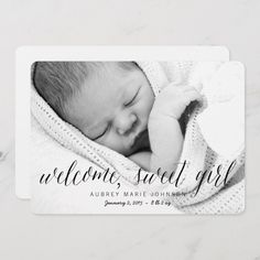 a black and white photo of a baby wrapped in a blanket with the words welcome, sweet boy