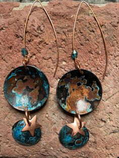 "Fumed patina, blue. Top is a 1\" domed circle. Bottom is a 1/2\" domed circle with copper star. Copper ear wires with a blue Swarovski crystal. Patina is finished/sealed with a clear lacquer." Blue Artisan Copper Earrings, Artisan Blue Copper Earrings, Hand Forged Blue Round Earrings, Unique Blue Copper Earrings, Blue Round Copper Jewelry, Blue Copper Round Jewelry, Caroline King, Enameling Jewelry, Wired Jewelry