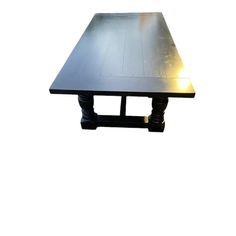 a metal table with two legs and a light on the top, against a white background