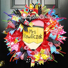 a colorful wreath with the words mr and mrs pawicak on it