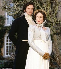 the man and woman are dressed in period clothing