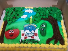 a birthday cake in the shape of a camper with trees and vegetables on it