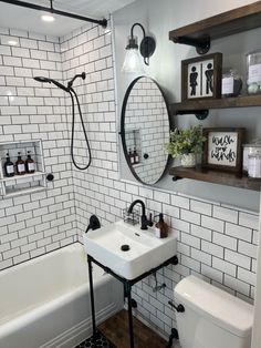 a white bathroom with black and white tile