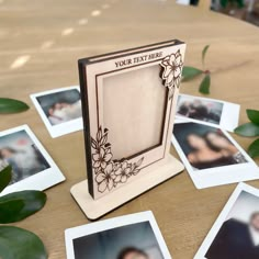 a photo frame sitting on top of a wooden table