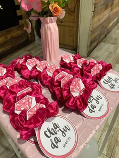 a table with pink and red decorations on it