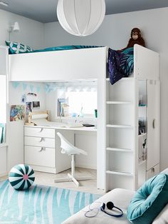 a child's bedroom with bunk beds, desk and bookshelf in it