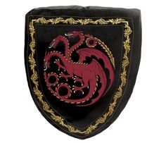 a black and red shield with a dragon on it