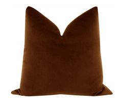 a brown pillow on a white background