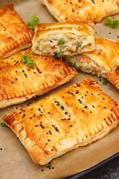 several pastries are arranged on a baking sheet