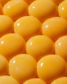 close up view of yellow balls in water