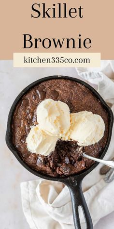 skillet brownie in a cast iron skillet with ice cream on top