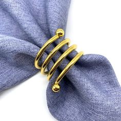 a blue tie with gold rings on it