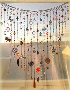 a window with many different colored beads hanging from it