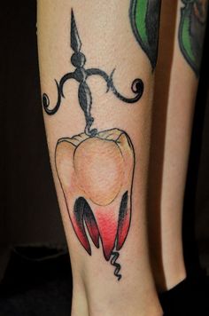 a tattoo on the leg of a person with a flower