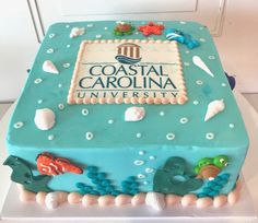 a cake decorated with sea animals and the words coastal carolina university on it's side