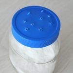 a blue and white container sitting on top of a table