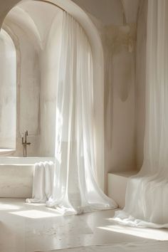 a white bath tub sitting next to a window