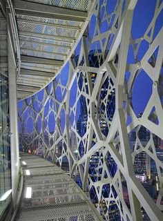 the walkway is designed to look like it has been made from metal and glass panels