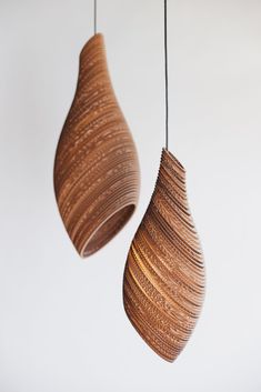 two wooden pendants hanging from the ceiling