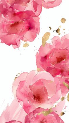 some pink flowers with gold spots on them and watercolor paint splatters all over the surface