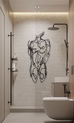 a bathroom with a tub, toilet and artwork on the shower wall in black and white