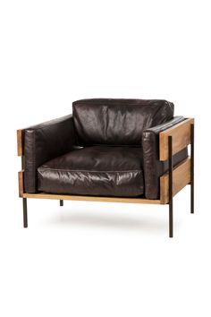 a brown leather chair sitting on top of a wooden frame