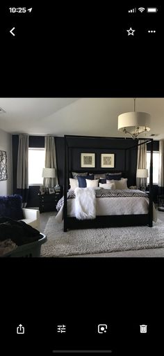 a large bed sitting in the middle of a bedroom