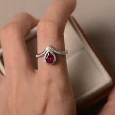 Lab ruby ring pear cut halo ring sterling silver red | Etsy Teardrop Ruby Ring With Diamond In Fine Jewelry Style, Teardrop Ruby Ring In Fine Jewelry Style, Fine Jewelry Teardrop Ruby Ring With Diamond, Elegant Teardrop Ruby Rings, Elegant Teardrop Ruby Ring For Formal Occasions, Formal Teardrop Ruby Ring, Elegant Pear-shaped Ruby Promise Ring, Elegant Pear-shaped Red Rings, Pear-shaped Ruby Rings