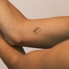 a person with a small tattoo on their arm